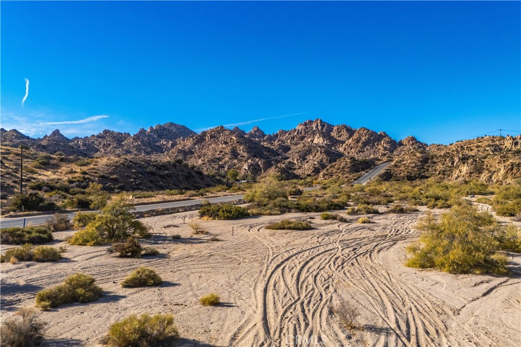 6350 Pioneertown Road Pioneertown, CA 92268 - Photo 22 of 36 a view of a yard with a house