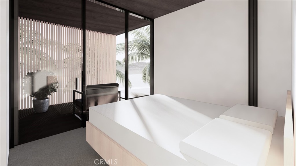 6350 Pioneertown Road Pioneertown, CA 92268 - Photo 31 of 36 a bed sitting in a bedroom next to a window