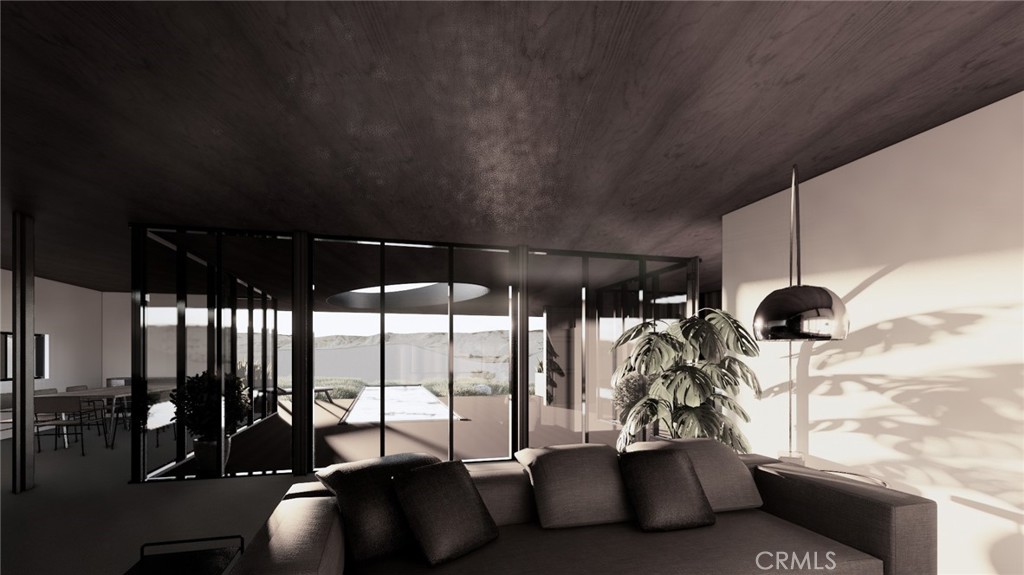 6350 Pioneertown Road Pioneertown, CA 92268 - Photo 35 of 36 a living room with furniture and a large window