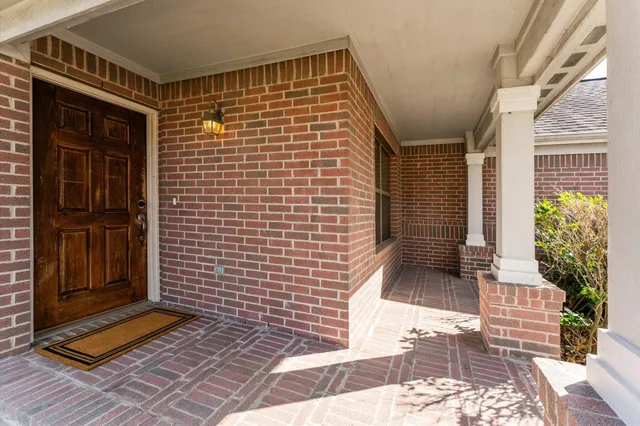 a view of a brick house with many windows