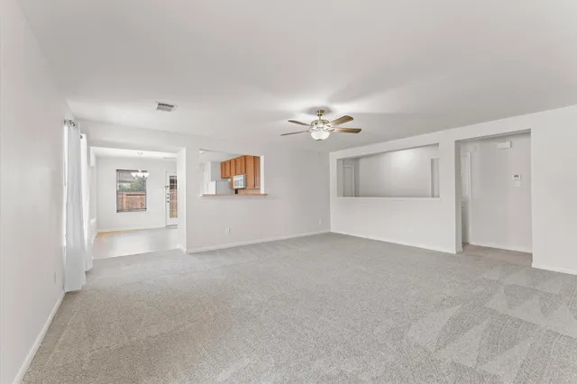 a view of an empty room with a bathroom