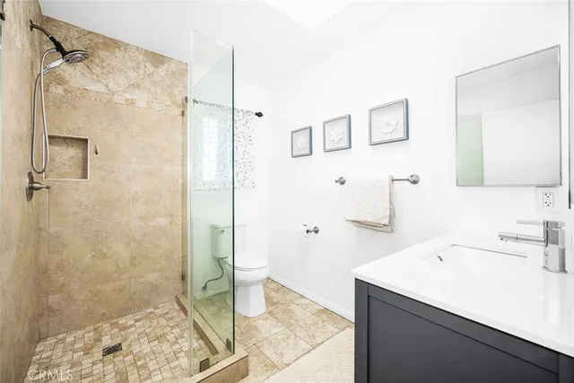 a bathroom with a granite countertop sink a mirror and a