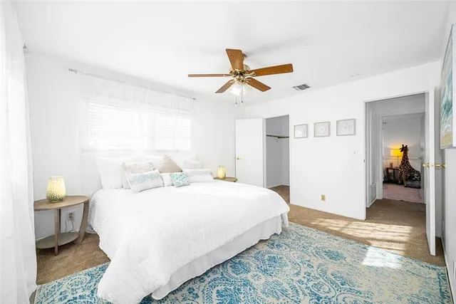 a bedroom with a bed and a table