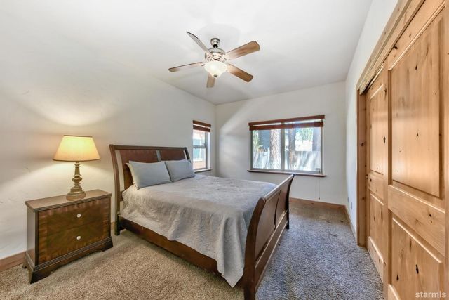 a spacious bedroom with a bed and window