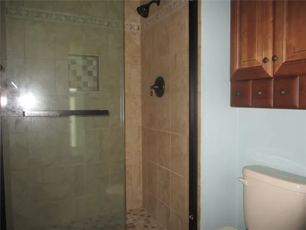 a bathroom with a sink a mirror and a window