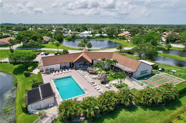 a view of a swimming pool with a patio