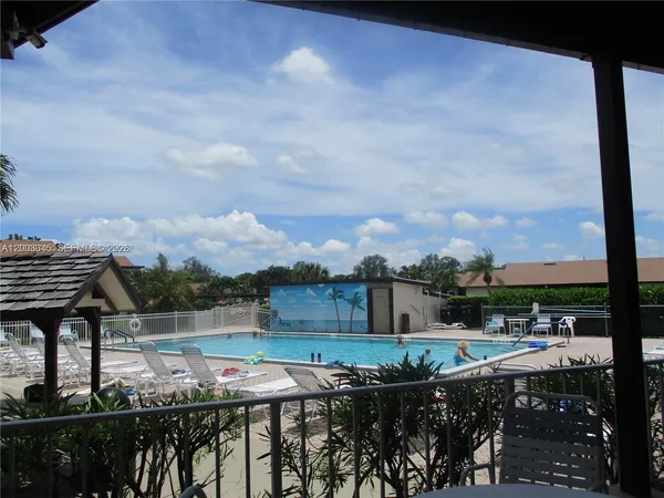a view of a balcony with furniture
