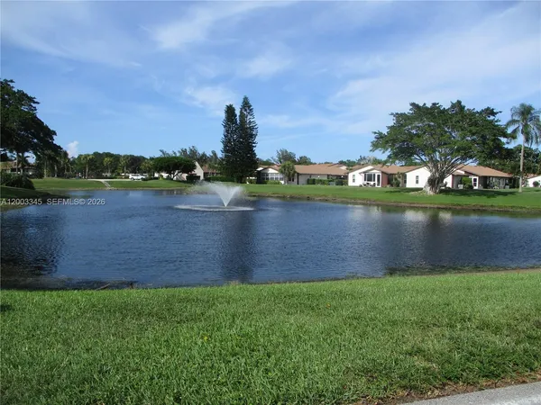 a view of a garden with a fountain