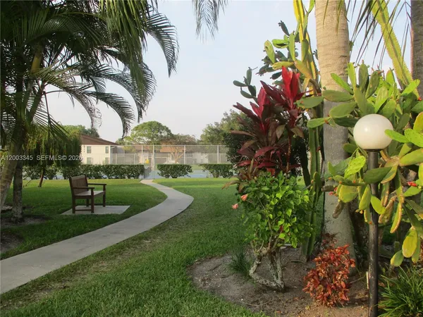 a view of a garden with a fountain