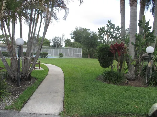 a view of an outdoor space and tennis court