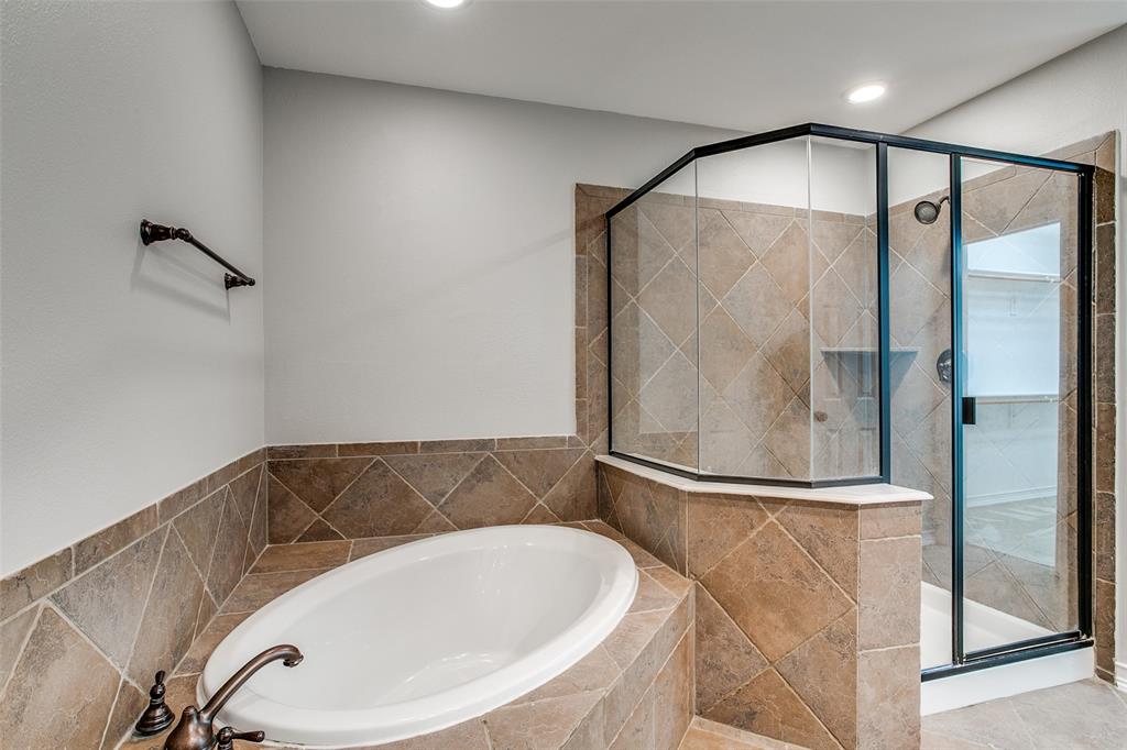 1600 Abrams Road, Unit 8 Dallas, TX 75214 - Photo 23 of 26 a bathroom with a bathtub and a shower