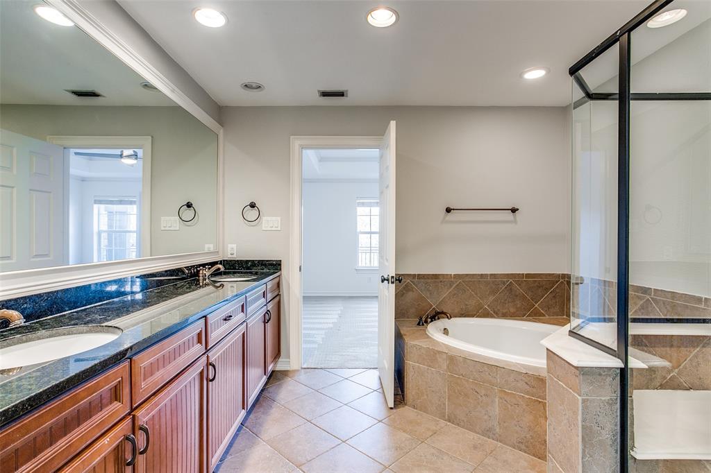1600 Abrams Road, Unit 8 Dallas, TX 75214 - Photo 24 of 26 a spacious bathroom with a granite countertop tub sink and mirror