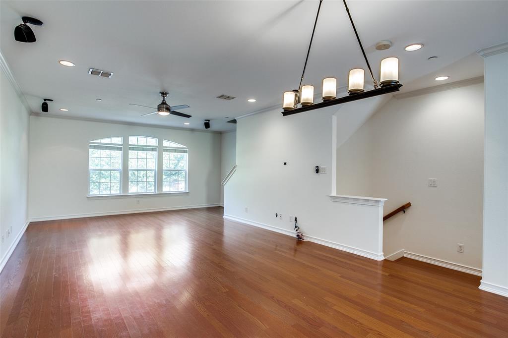 1600 Abrams Road, Unit 8 Dallas, TX 75214 - Photo 7 of 26 an empty room with wooden floor and windows