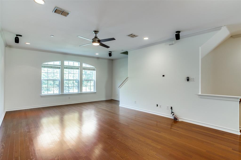 1600 Abrams Road, Unit 8 Dallas, TX 75214 - Photo 9 of 26 an empty room with wooden floor and windows