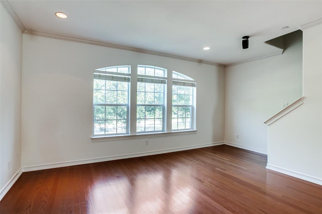 1600 Abrams Road, Unit 8 Dallas, TX 75214 - Photo 10 of 26 an empty room with wooden floor and windows