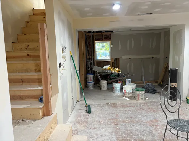 a view of a livingroom with furniture and a gate