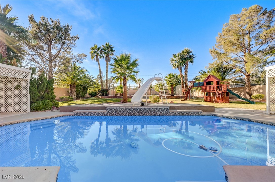 2955 El Camino Road Las Vegas, NV 89146 - Photo 82 of 99 Swimming pool with a water slide and a playground