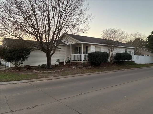 front view of a house with a street