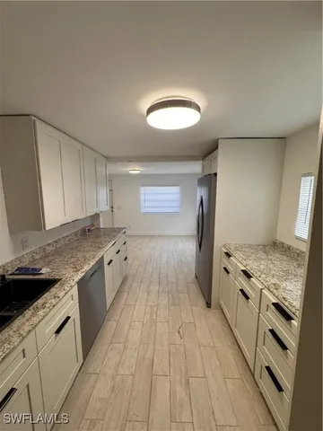 a kitchen with a stove and a sink