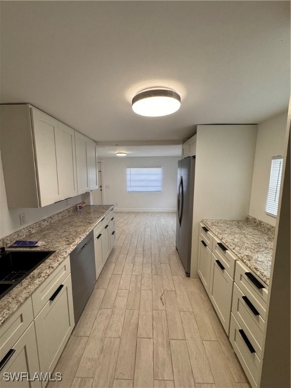15344 Wall Drive Fort Myers, FL 33908 - Photo 13 of 21 a kitchen with a stove and a sink