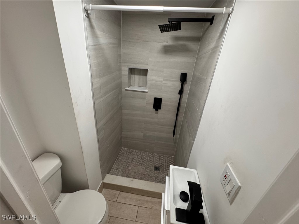 15344 Wall Drive Fort Myers, FL 33908 - Photo 3 of 21 a bathroom with a toilet and a shower