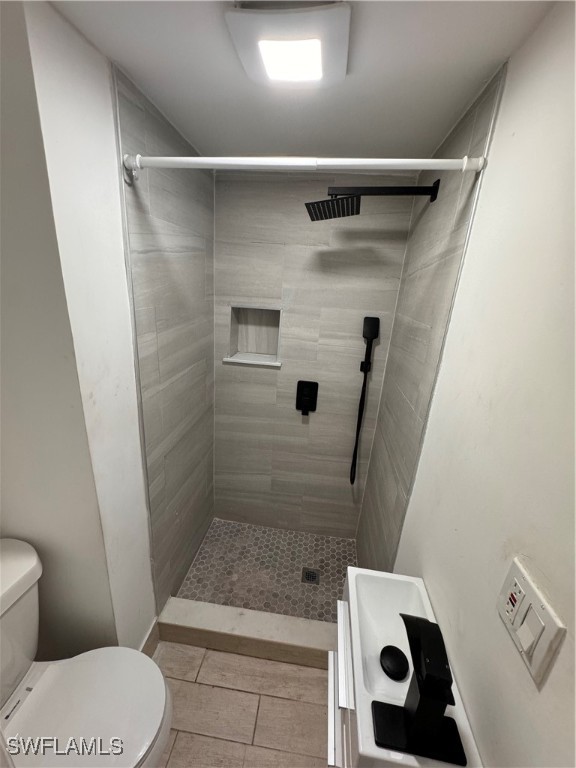 15344 Wall Drive Fort Myers, FL 33908 - Photo 5 of 21 a bathroom with a toilet and a shower