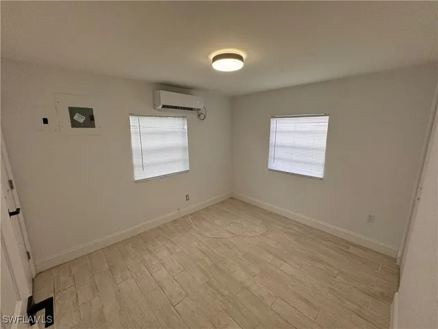 a view of an empty room with a window