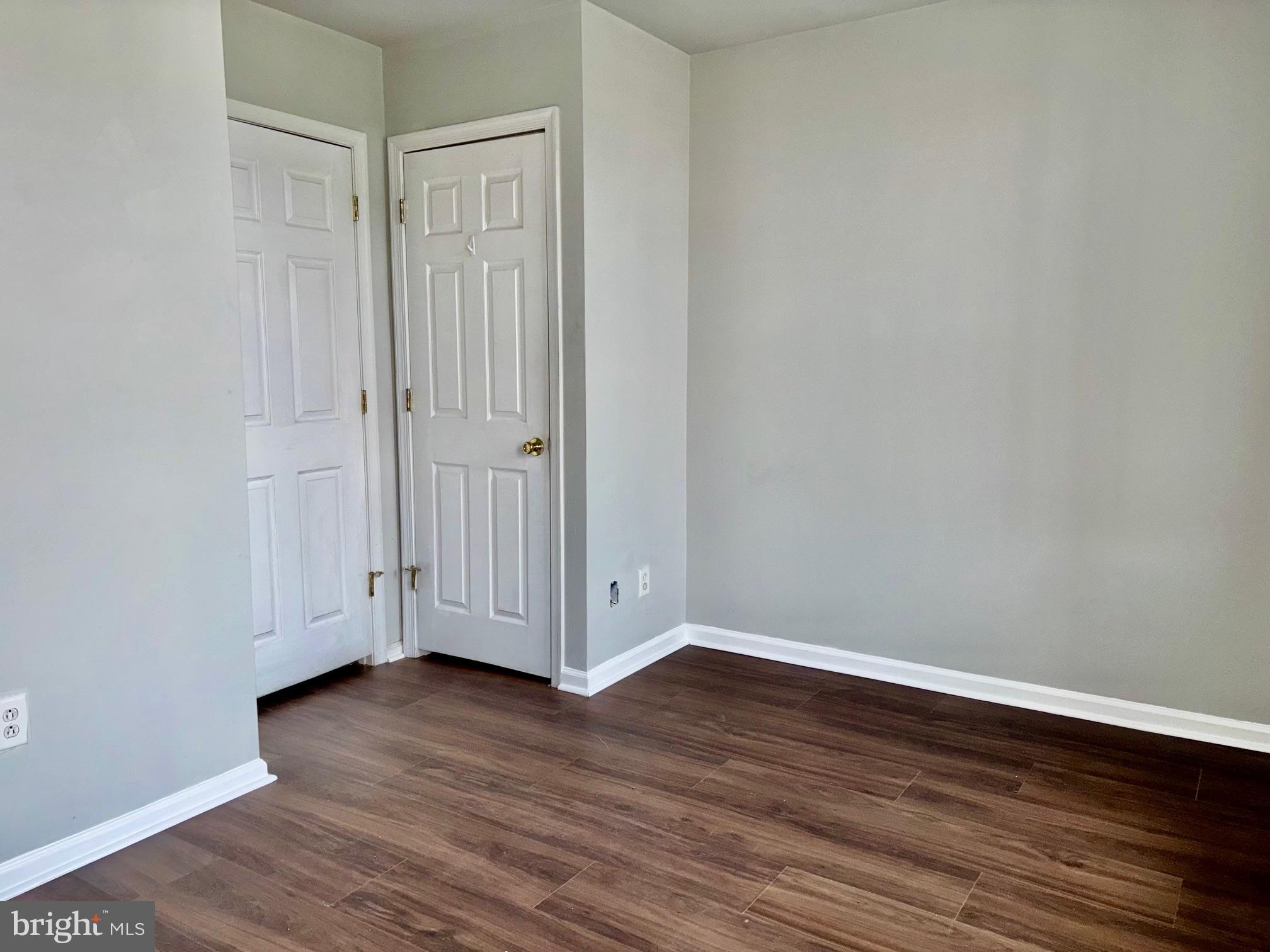5258 Hazel Avenue Philadelphia, PA 19143 - Photo 17 of 22 an empty room with wooden floor