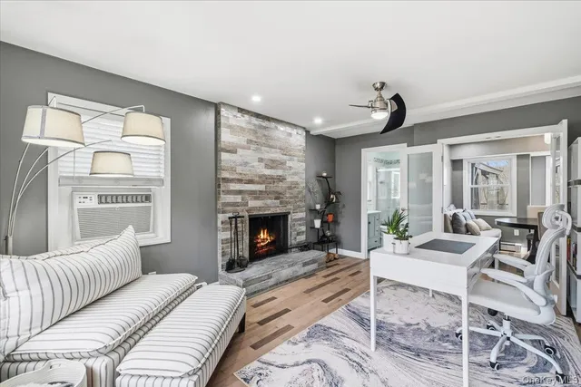 a living room with furniture and a fireplace