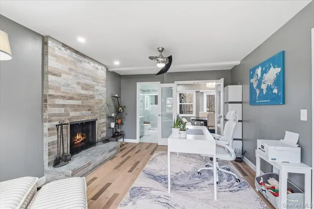 a living room with furniture and a fireplace