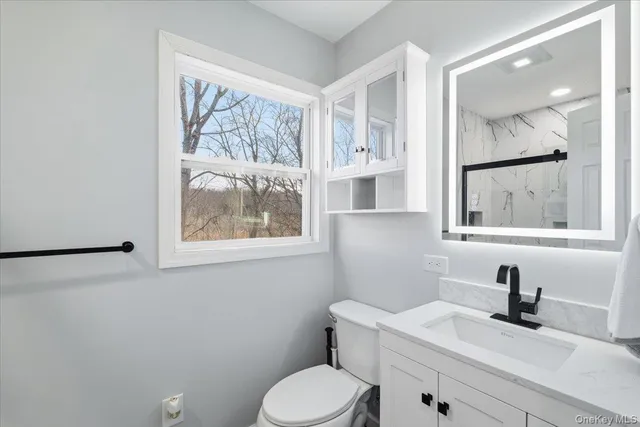 a bedroom with a bed and a desk