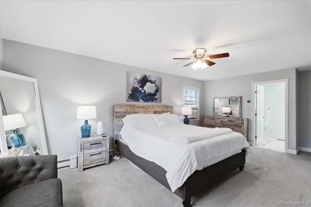 a bathroom with a sink toilet a mirror and shower