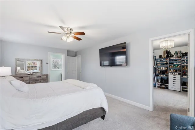 a bed room with a bed and a chair