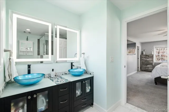 a bedroom with a bed and a television