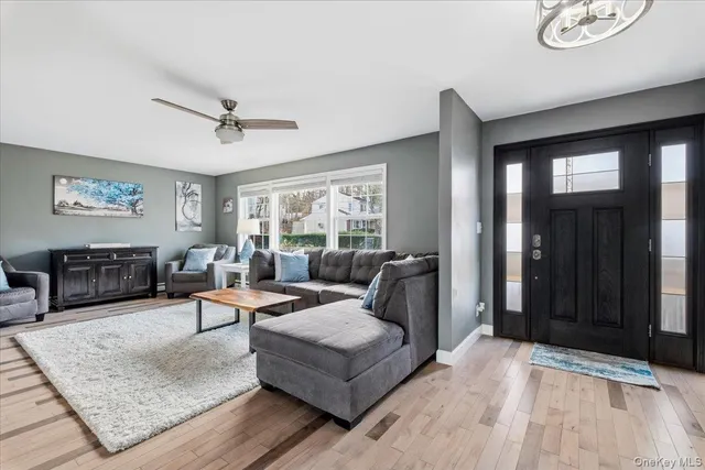 a living room with furniture and a window