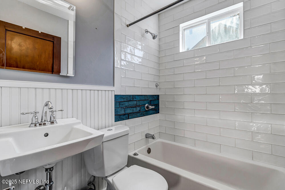 60 Weeden Street St. Augustine, FL 32084 - Photo 22 of 46 a bathroom with a sink a toilet and bathtub