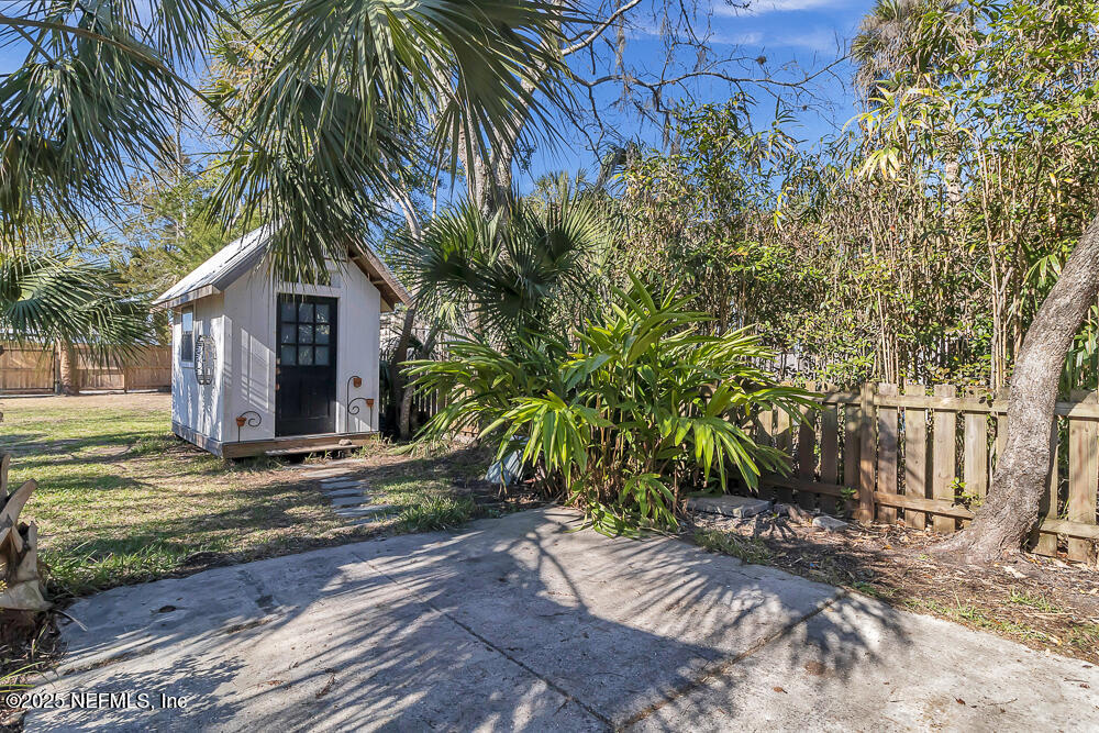 60 Weeden Street St. Augustine, FL 32084 - Photo 24 of 46 a view of a house with a yard and tree s