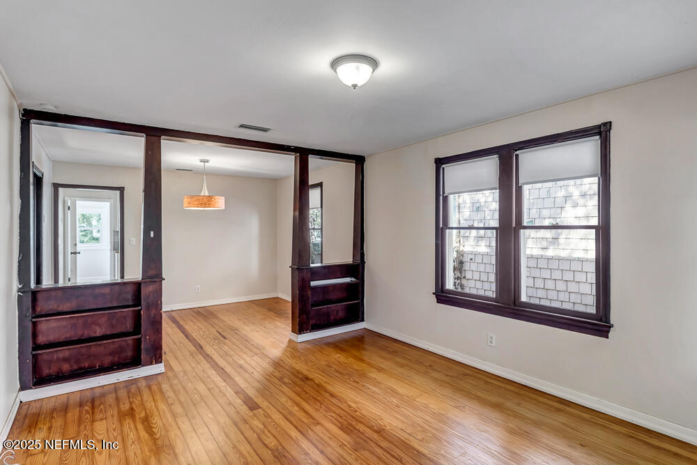 60 Weeden Street St. Augustine, FL 32084 - Photo 3 of 46 wooden floor in an empty room with a window