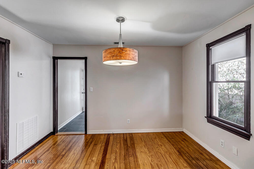 60 Weeden Street St. Augustine, FL 32084 - Photo 7 of 46 a view of empty room with window and wooden floor