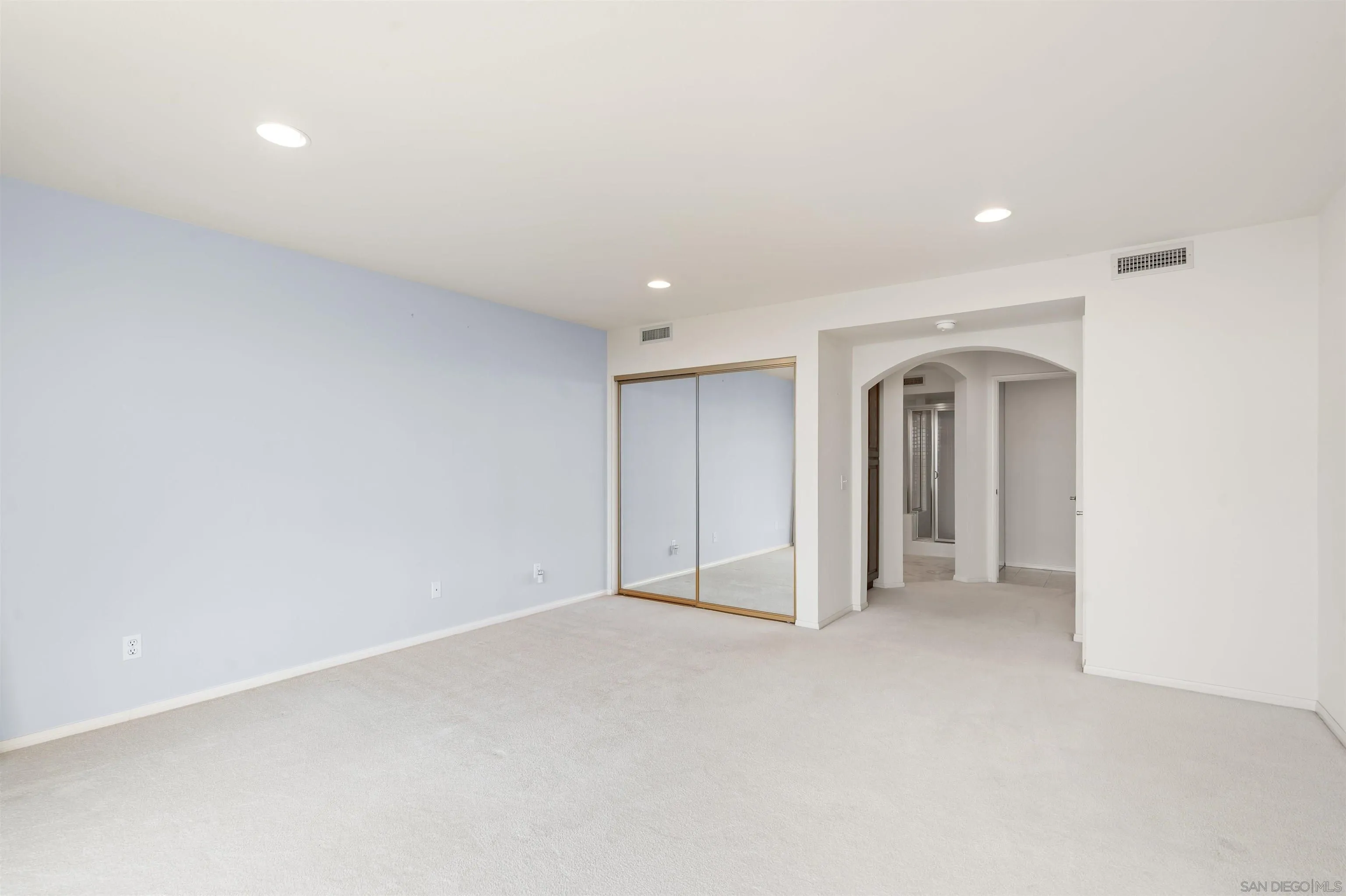 13286 Ocean Vista Road San Diego, CA 92130 - Photo 28 of 66 an empty room with closet and a window