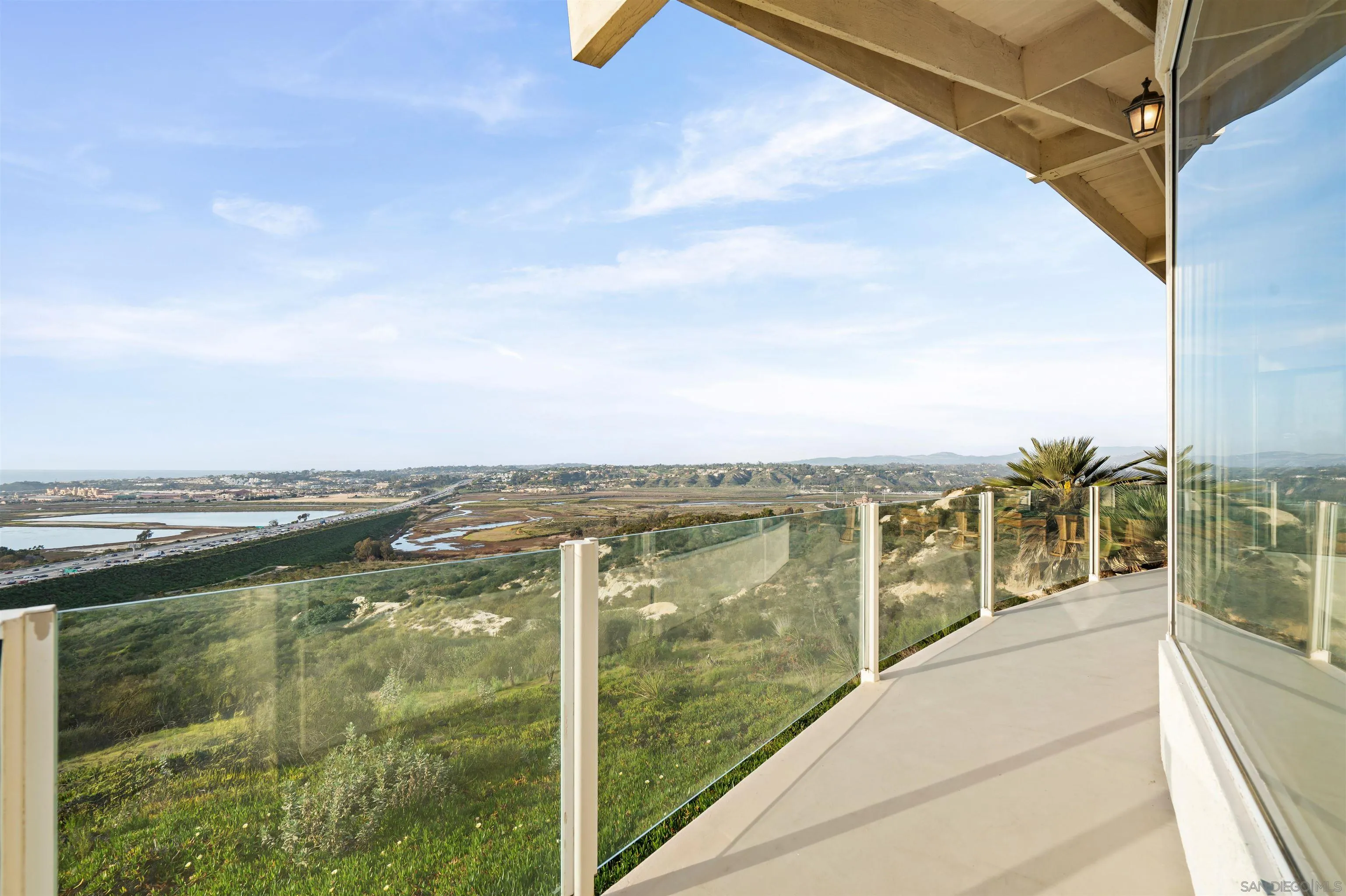 13286 Ocean Vista Road San Diego, CA 92130 - Photo 56 of 66 a view of a balcony next to a yard