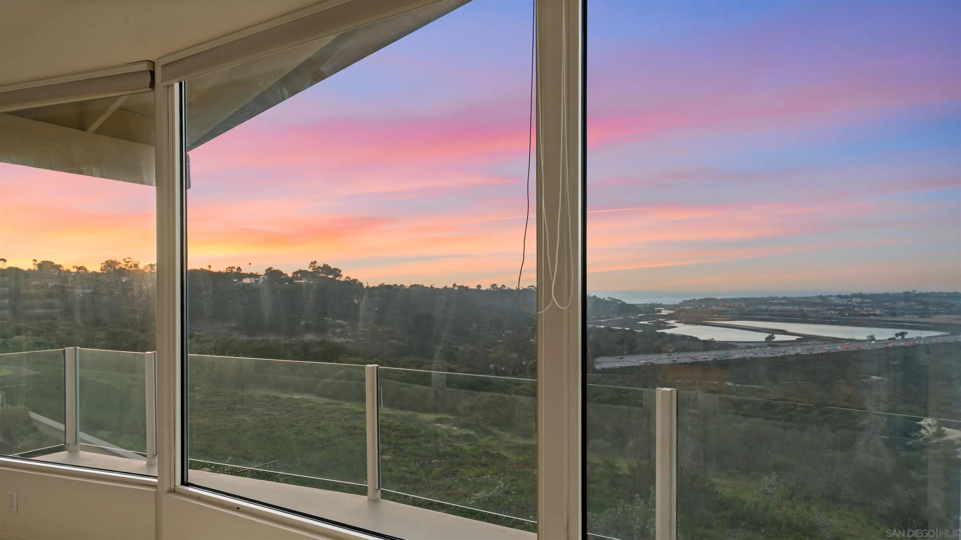 13286 Ocean Vista Road San Diego, CA 92130 - Photo 60 of 66 a view of a glass door and a window