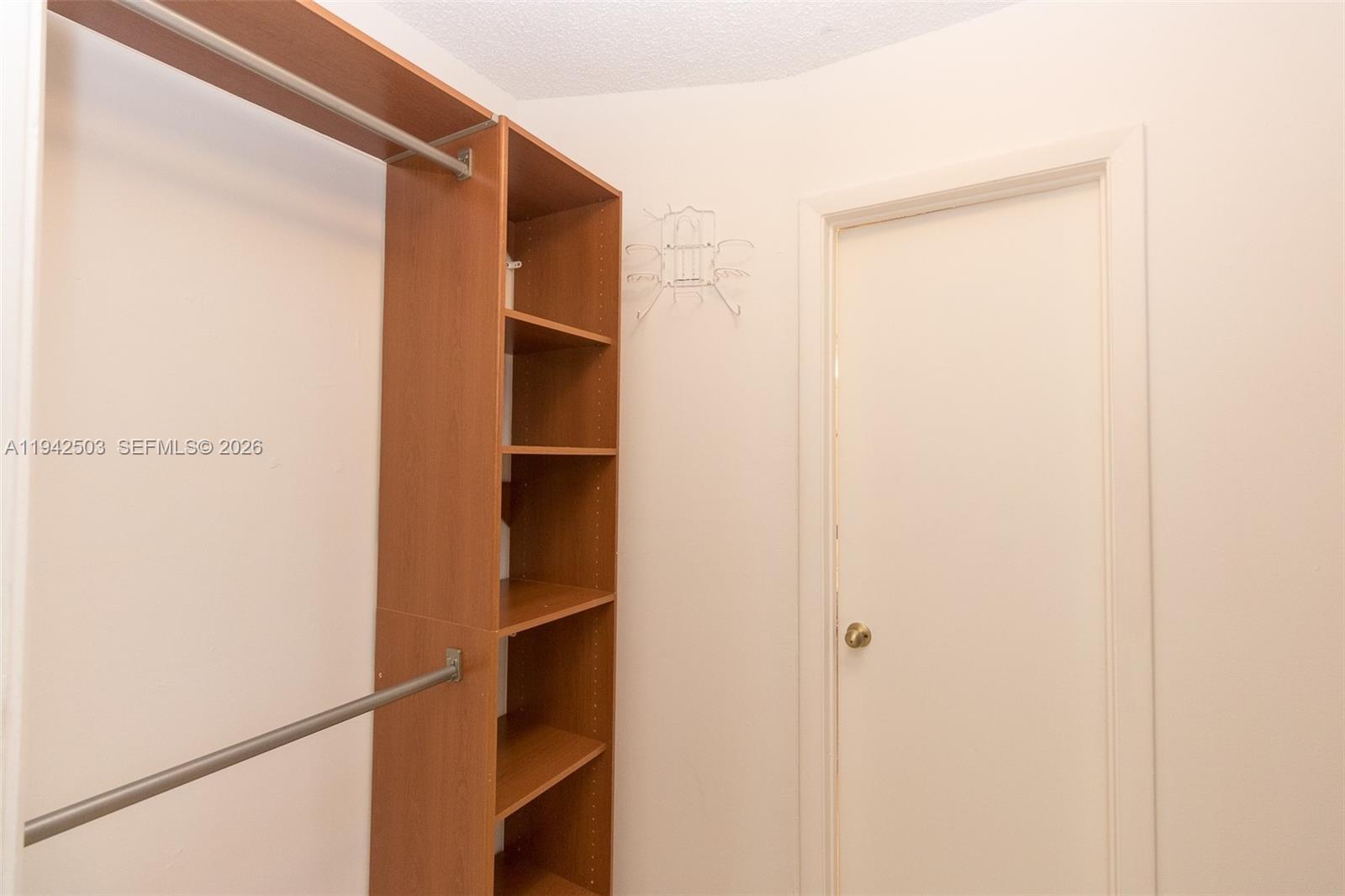 18328 Northwest 68th Avenue, Unit P Hialeah, FL 33015 - Photo 14 of 26 a view of walk in closet