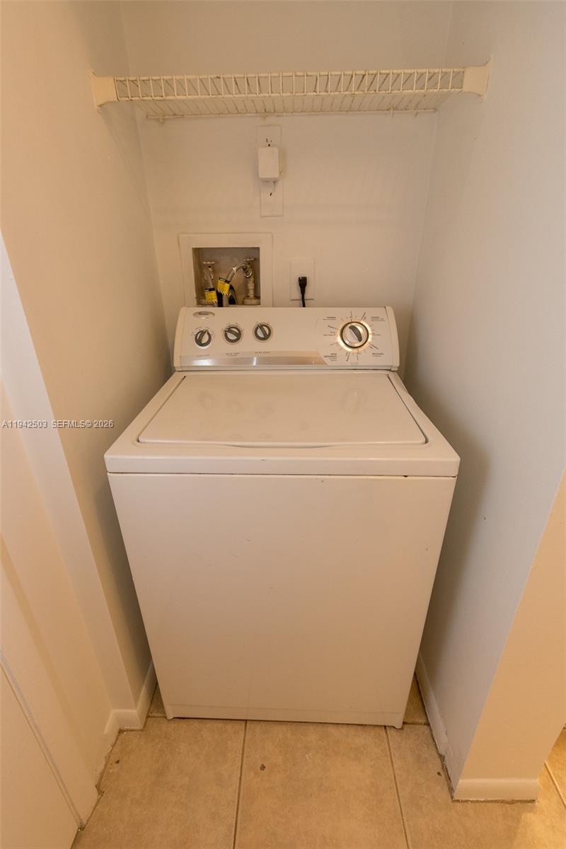 18328 Northwest 68th Avenue, Unit P Hialeah, FL 33015 - Photo 17 of 26 a utility room with dryer and washer