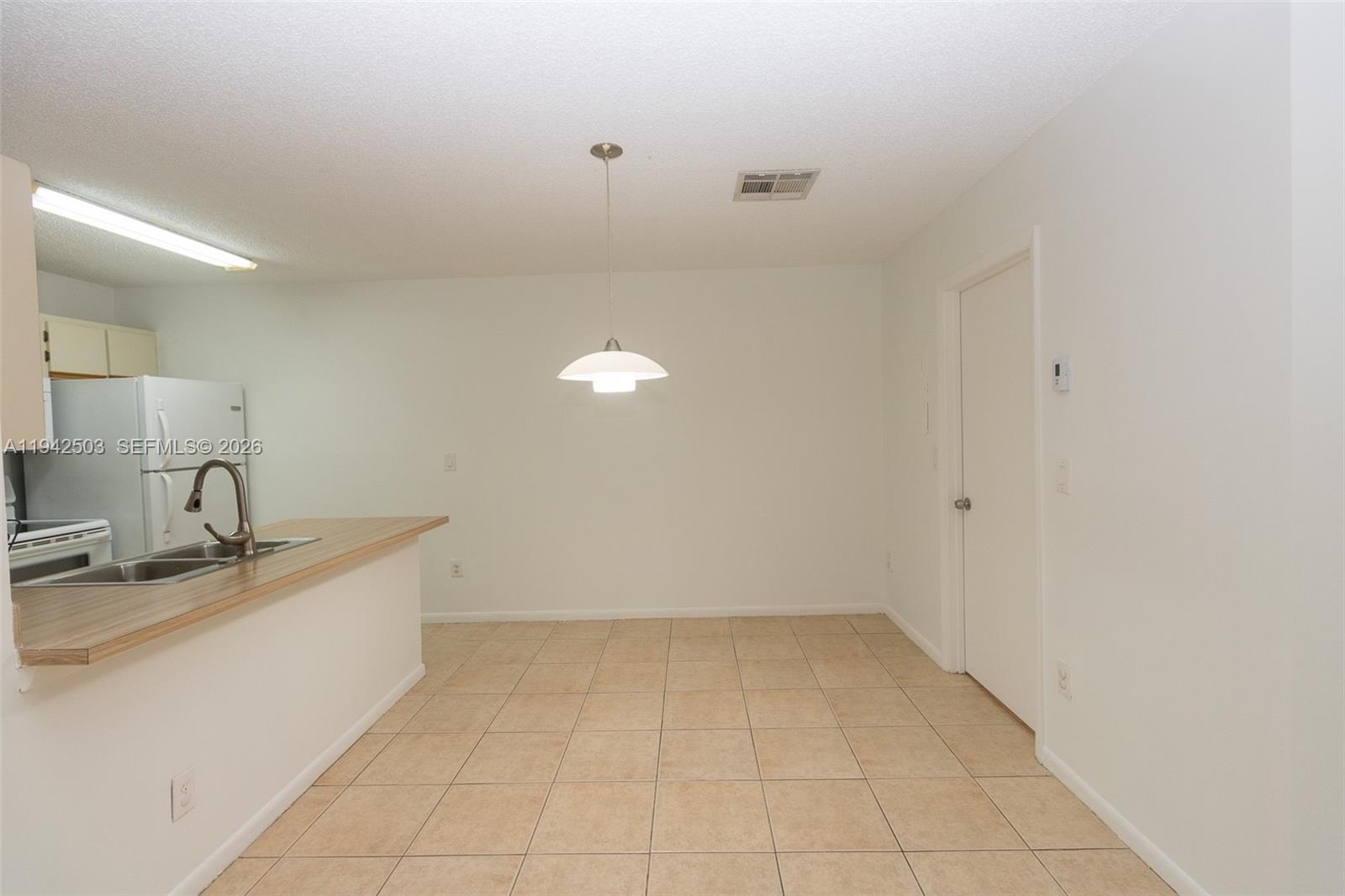 18328 Northwest 68th Avenue, Unit P Hialeah, FL 33015 - Photo 5 of 26 a view of a kitchen with a sink