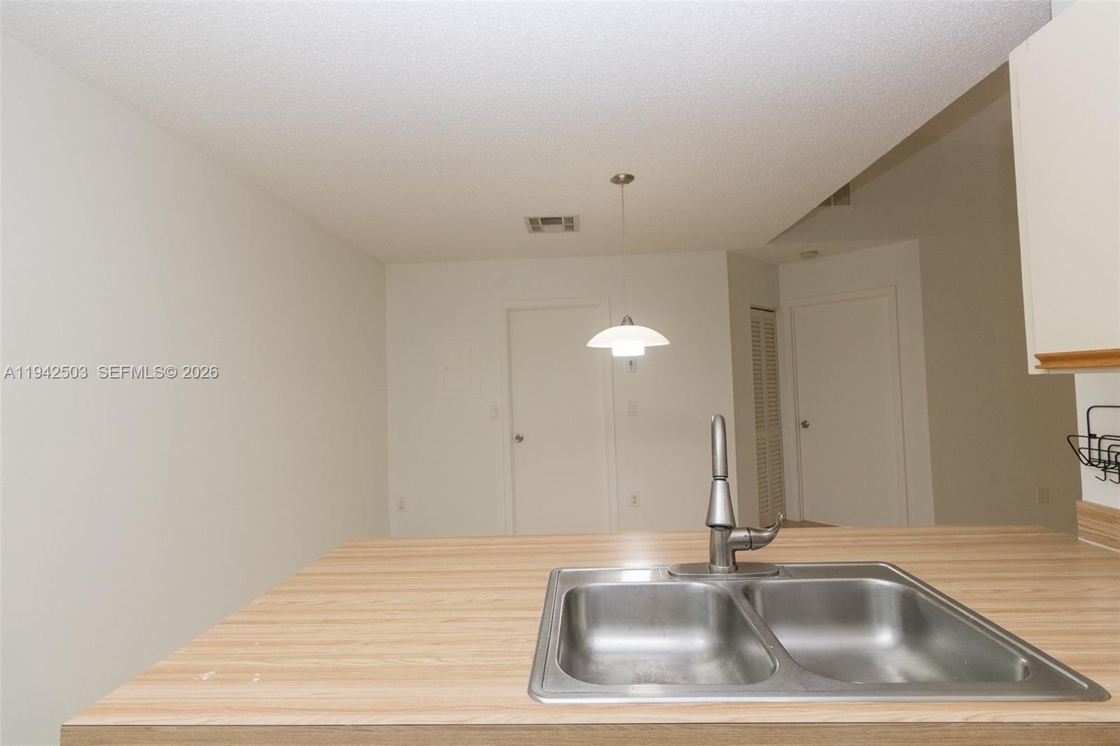 18328 Northwest 68th Avenue, Unit P Hialeah, FL 33015 - Photo 7 of 26 a close view of a sink a mirror and vanity