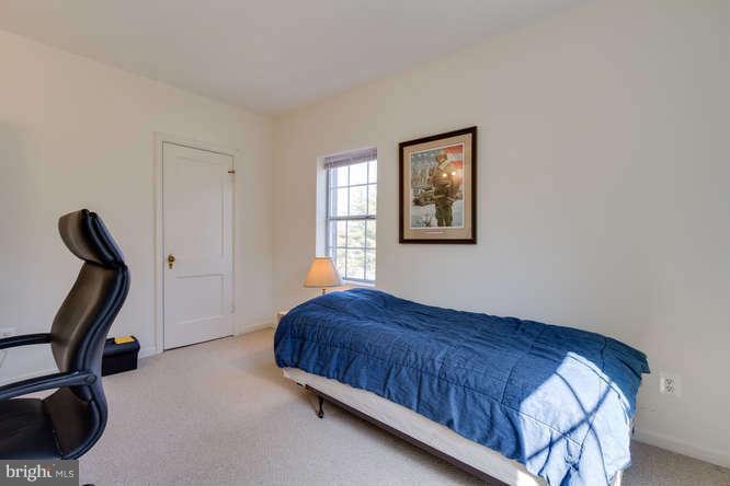 1924 North Rhodes Street, Unit 88 Arlington, VA 22201 - Photo 11 of 20 a bedroom with a bed and a window