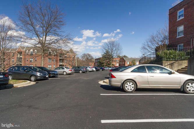1924 North Rhodes Street, Unit 88 Arlington, VA 22201 - Photo 16 of 20 a front view of a house with cars parked on the roadside