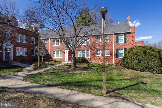 1924 North Rhodes Street, Unit 88 Arlington, VA 22201 - Photo 3 of 20 a view of a brick house next to a yard