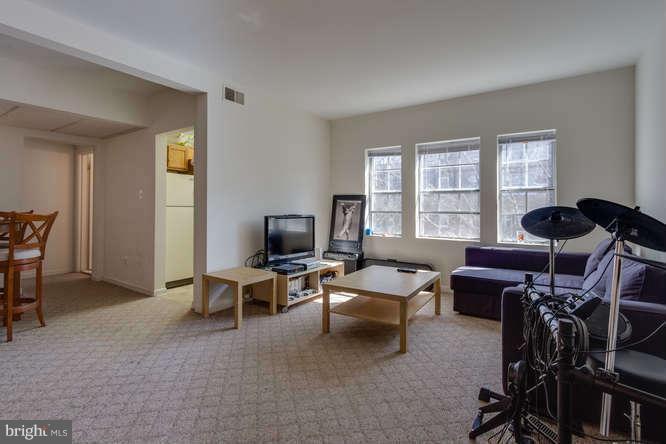 1924 North Rhodes Street, Unit 88 Arlington, VA 22201 - Photo 5 of 20 a living room with furniture a window and a flat screen tv
